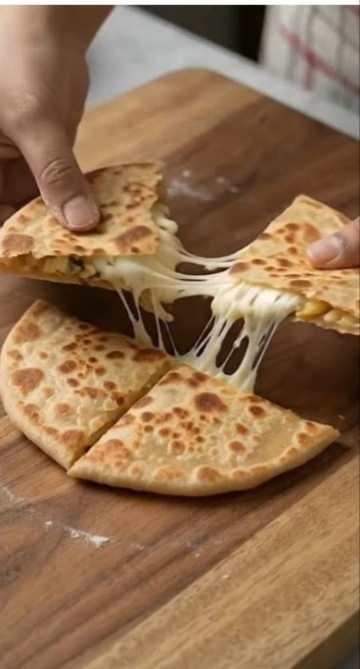 Cheesy paratha pulled apart